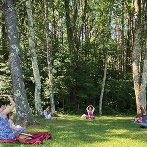 Parents with children in outdoor class setting