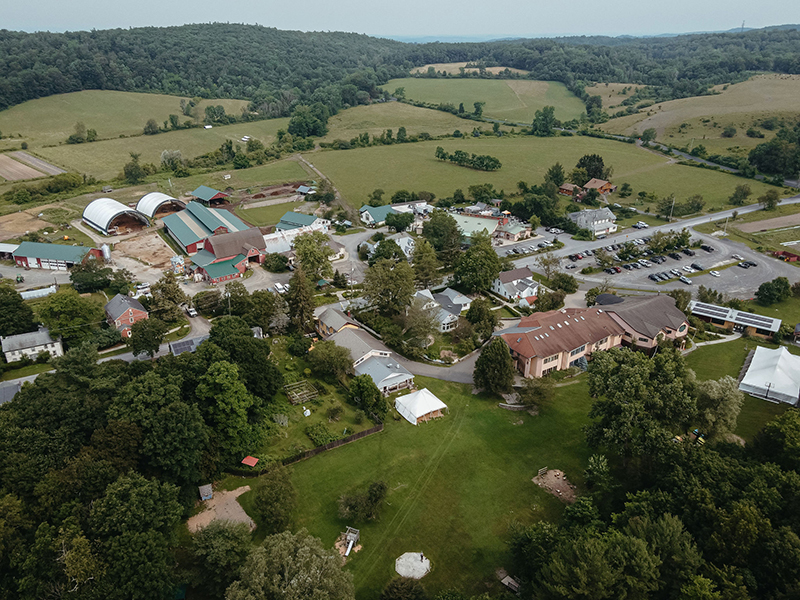aerial shot from drone of the Hawthorne Valley campus including the farm and surrounding hills