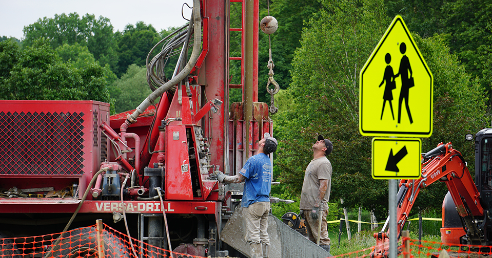 a construction crew overseeing the drilling of wells for a geothermal heating system at Hawthorne Valley Waldorf School